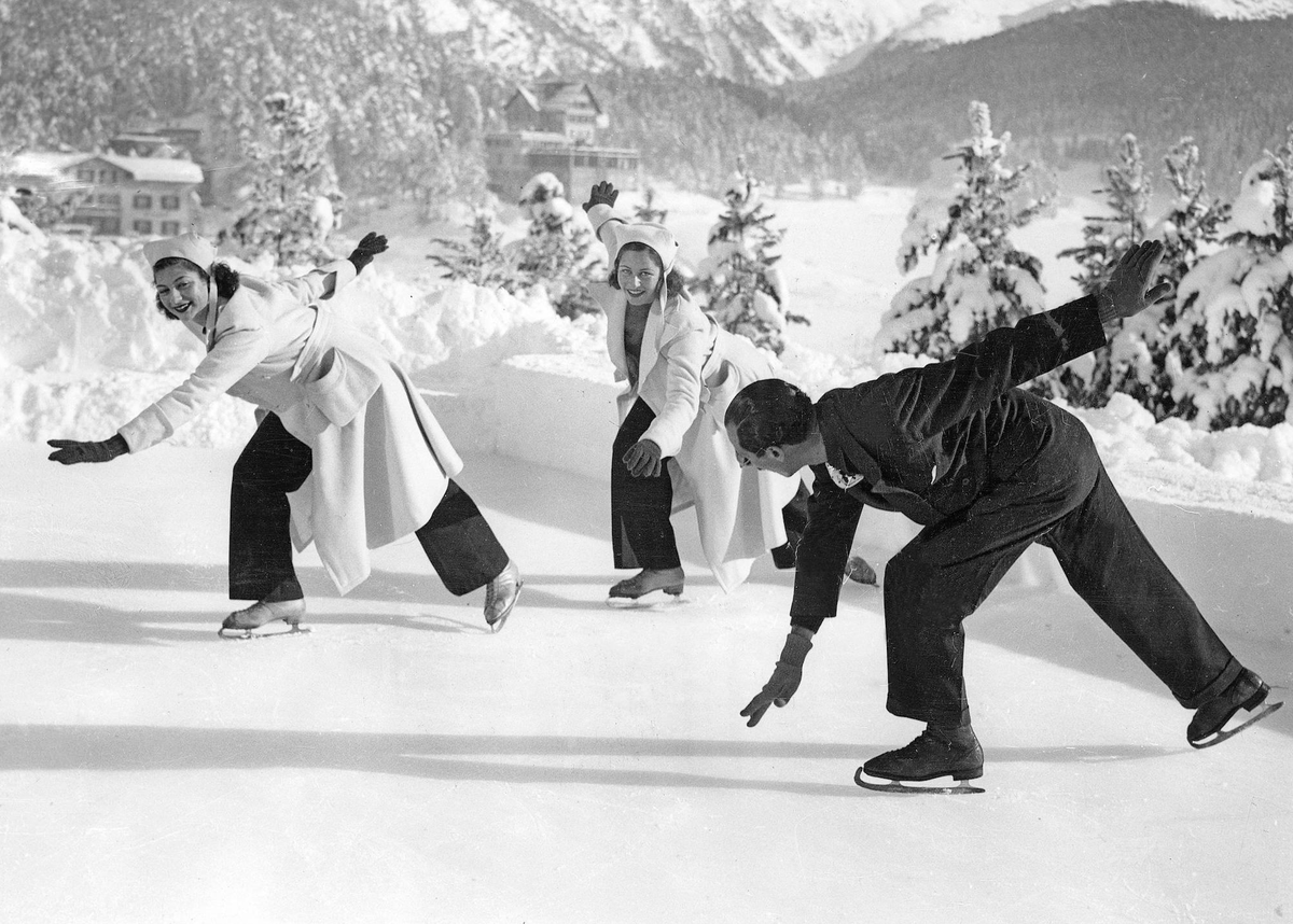 SWITZERLAND SAINT MORITZ circa 1935. Sisters Helga and Ingebrand Brandt Great Britain, leading ladies in the world of Figure skating, Eiskunstlauf are seen here performing a softening exercise on the  ...