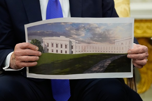 President Donald Trump holds an artist rendering of the new White House ballroom while meeting with NATO Secretary General Mark Rutte in the Oval Office of the White House in Washington, Wednesday, Oc ...