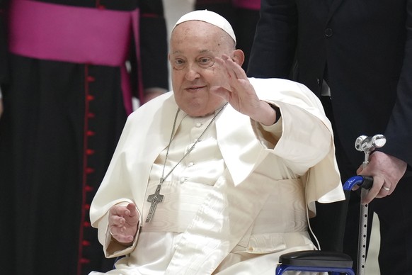 Pope Francis waves as he arrives for his weekly general audience in the Paul VI Hall, at the Vatican, Wednesday, Feb. 12, 2025. (AP Photo/Alessandra Tarantino)
Pope Francis
