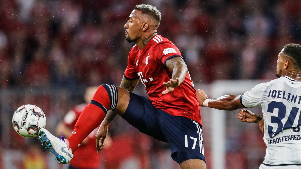 epa06969793 Bayern's Jerome Boateng (L) in action with Hoffenheim's Joelinton during the German Bundesliga soccer match between Bayern Munich and 1899 Hoffenheim in Munich, Germany, 24 Augus ...