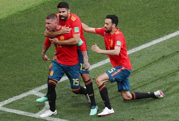 epa06855018 Sergio Ramos (L) of Spain celebrates with teammate Diego Costa (C) the 1-0 lead during the FIFA World Cup 2018 round of 16 soccer match between Spain and Russia in Moscow, Russia, 01 July  ...