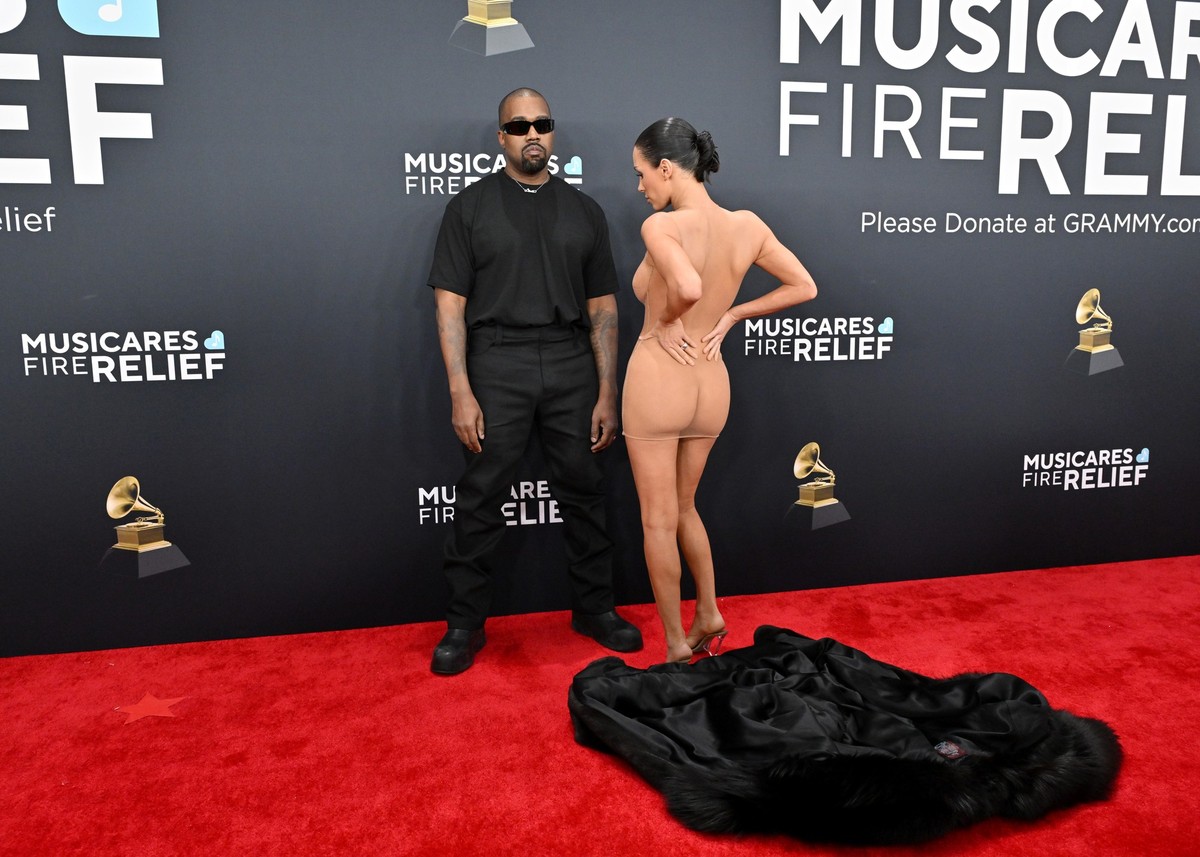 LOS ANGELES, CALIFORNIA - FEBRUARY 02: (FOR EDITORIAL USE ONLY) (EDITOR'S NOTE: Image contains nudity) Kanye West and Bianca Censori attend the 67th GRAMMY Awards at Crypto.com Arena on February  ...