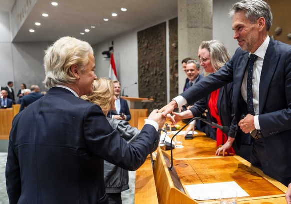epa11457979 Dutch Prime Minister Dick Schoof (R) and Geert Wilders after the debate on the government statement in the plenary hall of the House of Representatives in The Hague, the Netherlands, 04 Ju ...