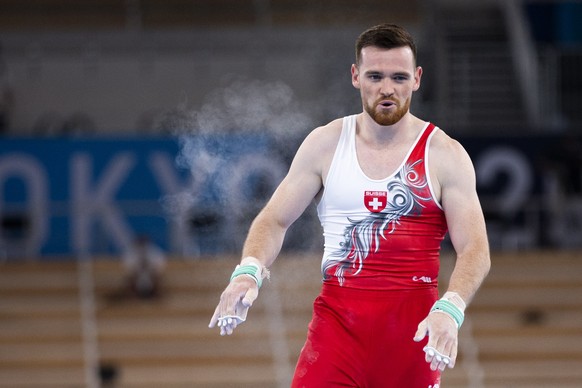 Benjamin Gischard of Switzerland reacts after his performance at the horizontal bar during the men&#039;s artistic gymnastics qualification at the 2020 Tokyo Summer Olympics in Tokyo, Japan, on Saturd ...