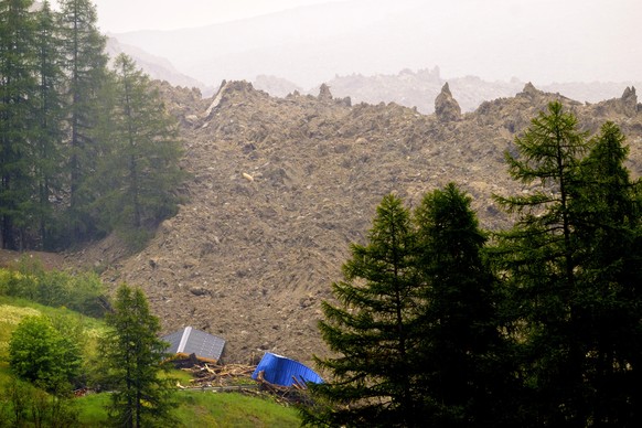 epa12140882 An avalanche from the Birch glacier destroys buildings near Blatten, Switzerland, Wednesday, May 28, 2025. The Birch Glacier has caused avalanches of ice, snow, water and rocks, as the lea ...