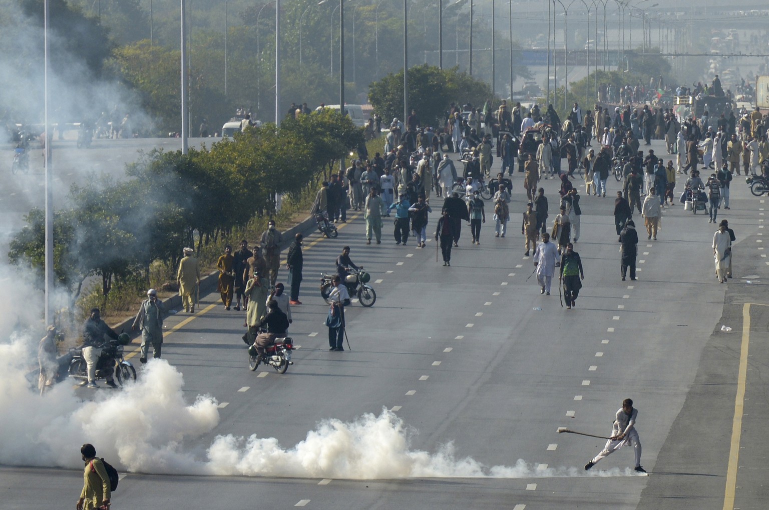Police fire tear gas shell to disperse supporters of imprisoned former premier Imran Khan&#039;s Pakistan Tehreek-e-Insaf party, during clashes, in Islamabad, Pakistan, Tuesday, Nov. 26, 2024. (AP Pho ...