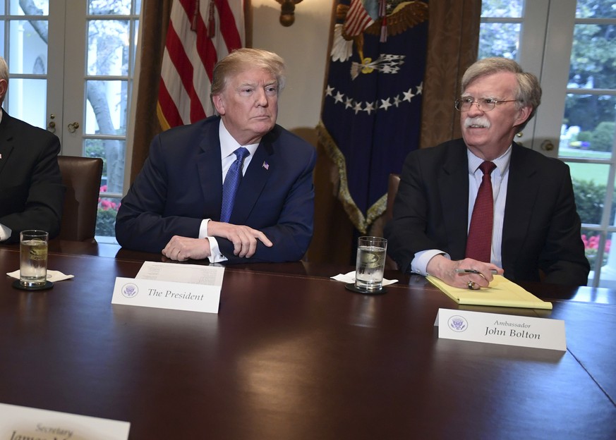 President Donald Trump, second from right, speaks in the Cabinet Room of the White House in Washington, Monday, April 9, 2018, at the start of a meeting with military leaders, with Defense Secretary J ...