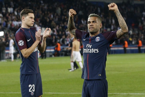 PSG&#039;s Dani Alves, right, celebrates besides teammate Julian Draxler after the Champions League Group B soccer match between Paris Saint-Germain and Bayern Munich in Paris, France, Wednesday, Sept ...