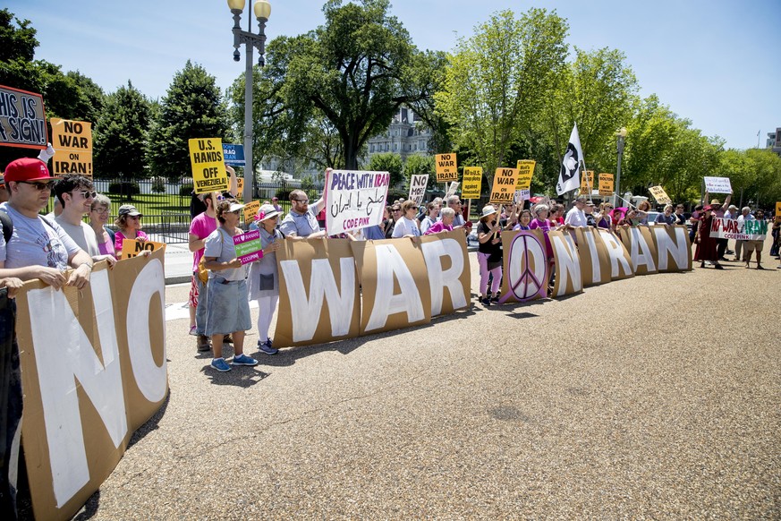 Members of the ANSWER Coalition hold an anti-war with Iran rally outside of the White House in Washington, Sunday, June 23, 2019. (AP Photo/Andrew Harnik)