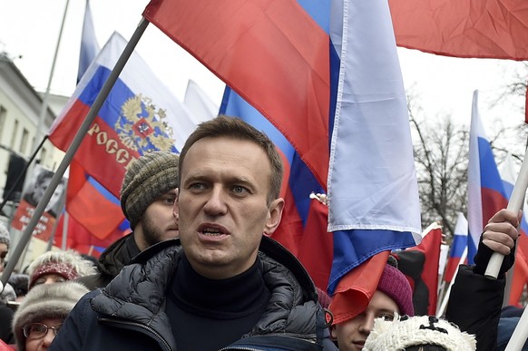 Russian opposition activist Alexei Navalny takes part in a march in memory of opposition leader Boris Nemtsov in Moscow, Russia, Sunday, Feb. 24, 2019. Thousands of Russians took to the streets of dow ...