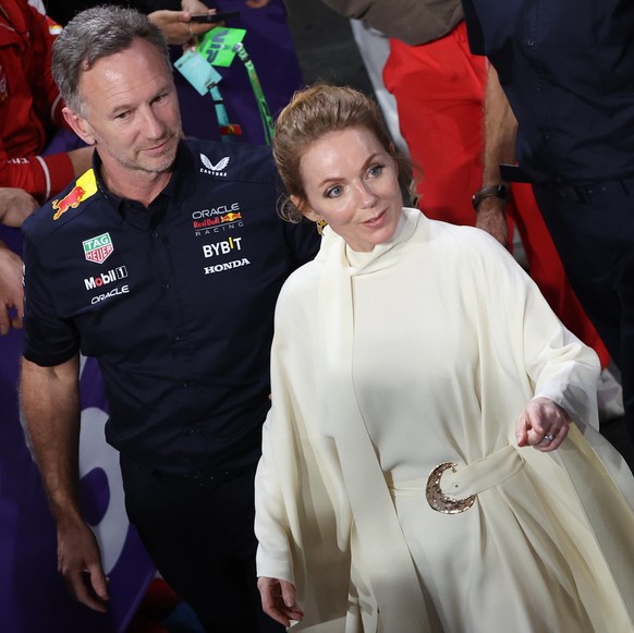 epa11209821 Red Bull Racing team principal Christian Horner (L) and his wife Geri Horner for the podium ceremony to begin after the Formula 1 Saudi Arabia Grand Prix at the Jeddah Corniche Circuit in  ...