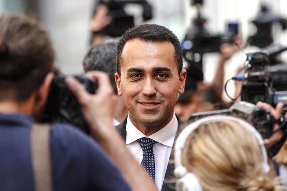 Luigi Di Maio, who leads the euroskeptic 5-Star Movement, smiles as he leaves a lower chamber office at the end of his meeting with Matteo Salvini, who heads the right-wing League party, in Rome, Frid ...