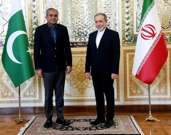 epa13022603 A handout photo made available by the Iranian Foreign Ministry shows Iranian Foreign Minister Abbas Araghchi (R) receiving Pakistani Interior Minister Mohsin Naqvi in Tehran, Iran, 07 June ...