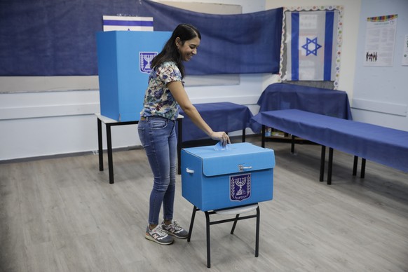 A woman votes a polling station in Rosh Haayin, Israel, Tuesday, Sept. 17, 2019. Israelis began voting Tuesday in an unprecedented repeat election that will decide whether longtime Prime Minister Benj ...