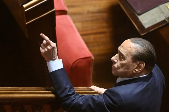 epa10240586 Leader of Forza Italia party, Silvio Berlusconi, reacts during the vote for the new president of the Senate, in Rome, Italy, 13 October 2022. Italian Senators and Deputies meet for the fir ...