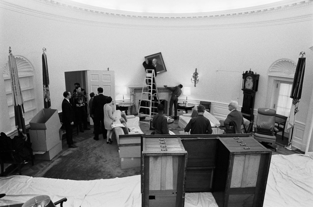 Elevated view of White House staff movers as they clear furniture from the the Oval Office, Washington DC, January 20, 1969. They were removing outgoing President Johnson's furnishings to make wa ...