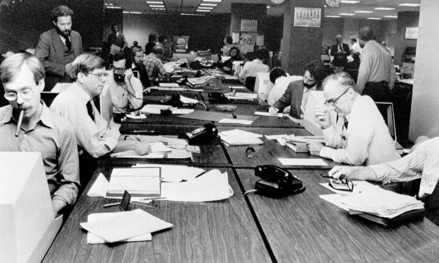 The newsroom at the New York Times is seen as editorial staffers work feverishly to prepare a Monday edition, in this Nov. 5, 1978 photo. A reader-submitted question related to how newsrooms are alert ...