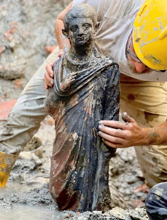epa10294005 An undated handout photo made available by the Italian Ministry of Culture press office shows one of the twenty-four bronze statues, of the Roman Etruscan age discovered in San Casciano de ...