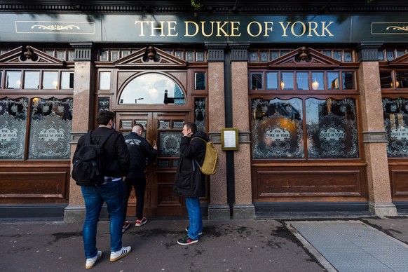 epa09689844 People outside The Duke of York pub in Victoria, London, Britain, 16 January 2022. Landlords are considering whether to change the name of their Duke of York pubs across the country to avo ...