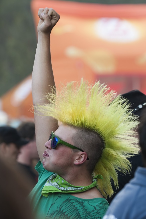 A festival-goer enjoys as the band &quot;Skindred&quot; performs on the stage 1 during the Gampel Open Air Festival in Gampel, Switzerland, Thursday, August 14, 2014. (KEYSTONE/Anthony Anex)