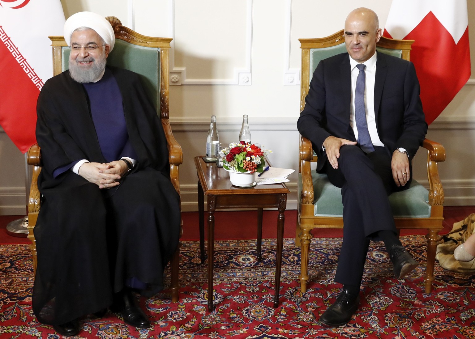 Swiss Federal President Alain Berset, right, and Iranian President Hassan Rohani at the beginning of a meeting during Rohani's official visit to Switzerland in Bern, Monday, July 2, 2018. (KEYSTO ...