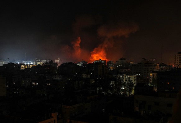 epa09205646 Smoke rise after an Israeli air strike in Gaza City, 16 May 2021. Thirteen Palestinian were killed and more than 40 others wounded after Israeli air strike in Gaza. In response to days of  ...