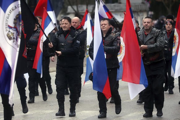 Local members of Russian Night Wolves Motorcycle Club march during a parade marking the 31st anniversary of the Republic of Srpska in Istocno Sarajevo, Bosnia, Monday, Jan. 9, 2023. Thousands of flag- ...