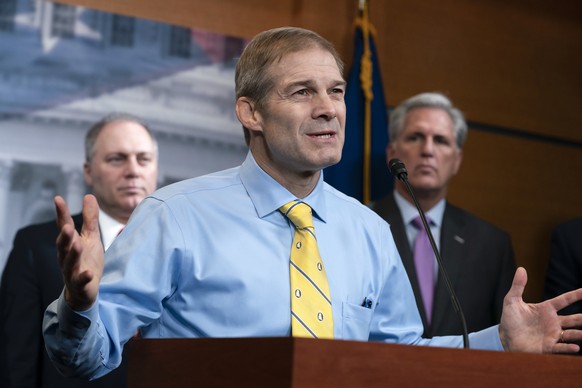 FILE - Rep. Jim Jordan, R-Ohio, center, is flanked by Rep. Steve Scalise, R-La., left, and House Republican Leader Kevin McCarthy, D-Calif., as they criticize Democrats for launching a formal impeachm ...