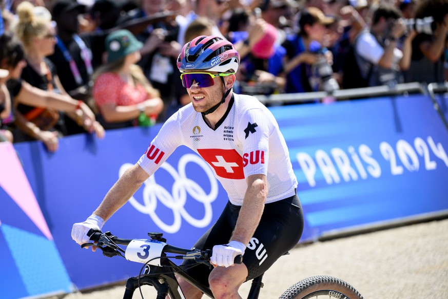 Mathias Flueckiger of Switzerland reacts after crossing the Men&#039;s Cross-country race at the 2024 Paris Summer Olympics in Paris, France, Monday, July 29, 2024. (KEYSTONE/Laurent Gillieron)