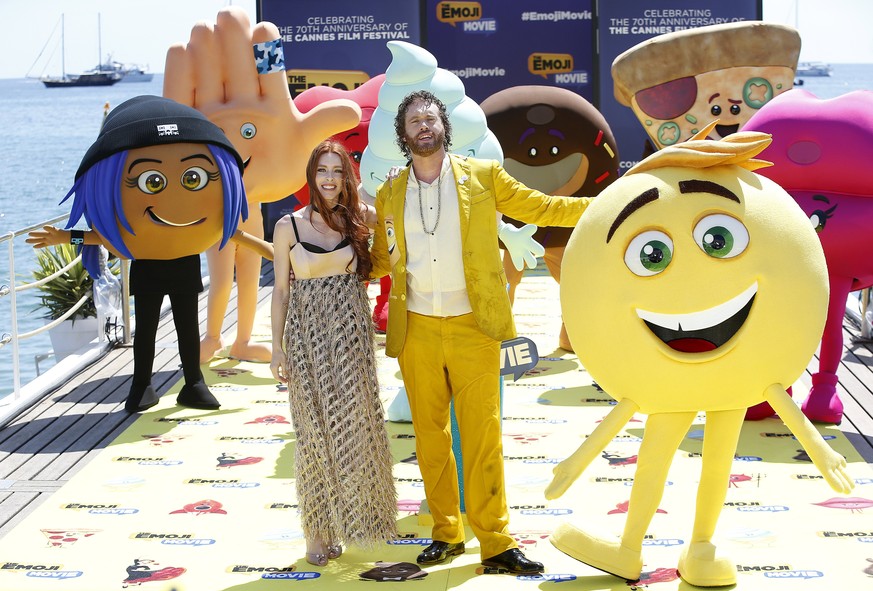 epa05967793 US actor T.J. Miller (R) and his wife Kate (L) pose with Emoji characters during the photocall for &#039;The Emoji Movie&#039; at the 70th annual Cannes Film Festival, in Cannes, France, 1 ...