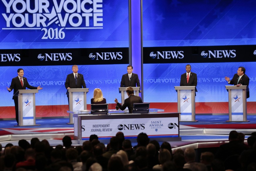 Republican presidential candidate, Sen. Marco Rubio, R-Fla., left, spars with Republican presidential candidate, New Jersey Gov. Chris Christie, right as Republican presidential candidate, businessman ...