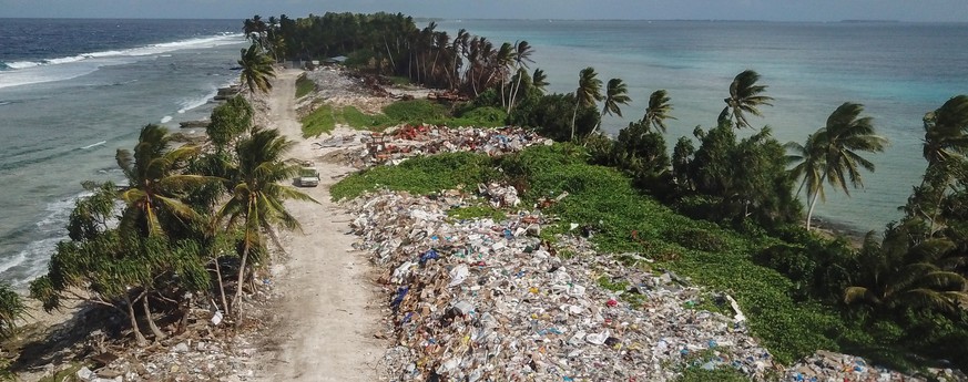 epa07774363 An aerial view of the rubbish dump used to dispose waste is seen north of Funafuti, Tuvalu, 15 August 2019. The 50th Pacific Islands Forum and Related Meetings, fostering cooperation betwe ...