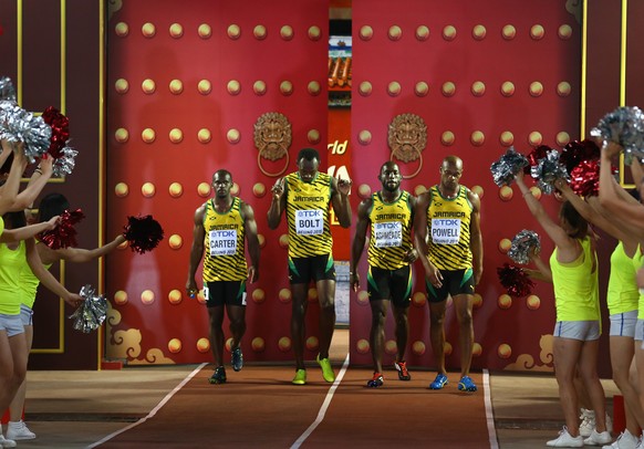 BEIJING, CHINA - AUGUST 29: Nickel Ashmeade of Jamaica, Asafa Powell of Jamaica, Usain Bolt of Jamaica of Jamaica and Nesta Carter of Jamaica enter the stadium prior to the Men&#039;s 4x100 Metres Rel ...