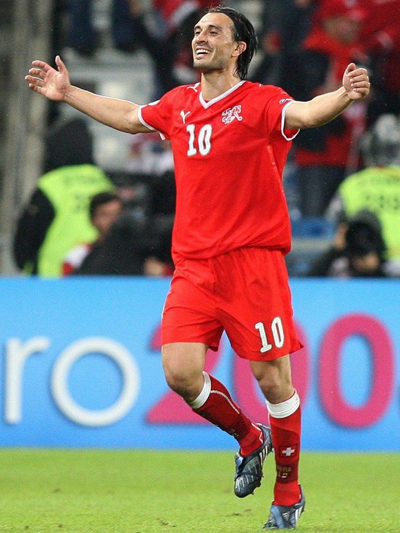 epa01383693 Swiss Hakan Yakin celebrates his second goal during the EURO 2008 preliminary round group A match between Switzerland and Portugal at the St. Jakob Park stadium, Basel, Switzerland, 15 Jun ...