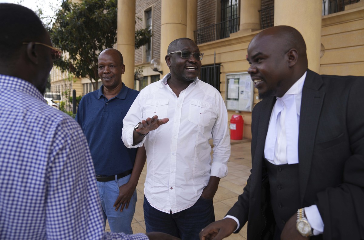 Kenya's former presidential candidate Ekuru Aukot, center, gestures outside the Milimani court in the capital Nairobi, Kenya, Friday, Jan. 26, 2024. A Kenyan court on Friday blocked the deploymen ...
