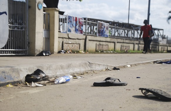 A view of flip fops and sandals on the street, following a stampede in Port Harcourt, Nigeria, Saturday, May 28, 2022. Police say a stampede at a church charity event in southern Nigeria has left at l ...