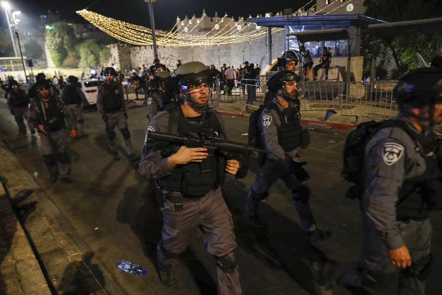 epa09186625 Israeli border police during a protest in support of Palestinian families that face eviction from their homes at Sheikh Jarrah neighborhood, near Damascus gate in the old city of Jerusalem ...