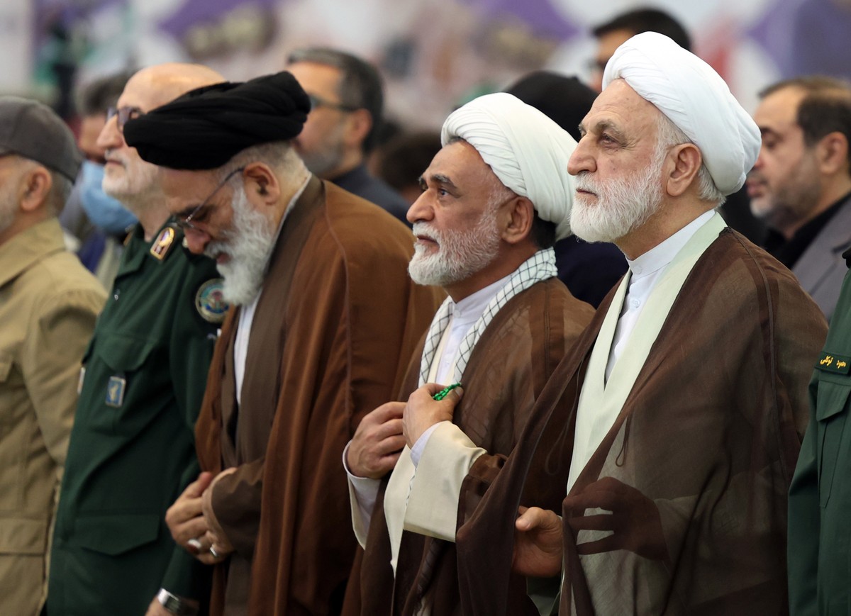 epa12990456 Iran's Judiciary Chief Gholamhossein Mohseni Ejei (R) attends a memorial ceremony for those killed in the Iran-US-Israel war at Mosallah Mosque in Tehran, Iran, 24 May 2026. The cerem ...