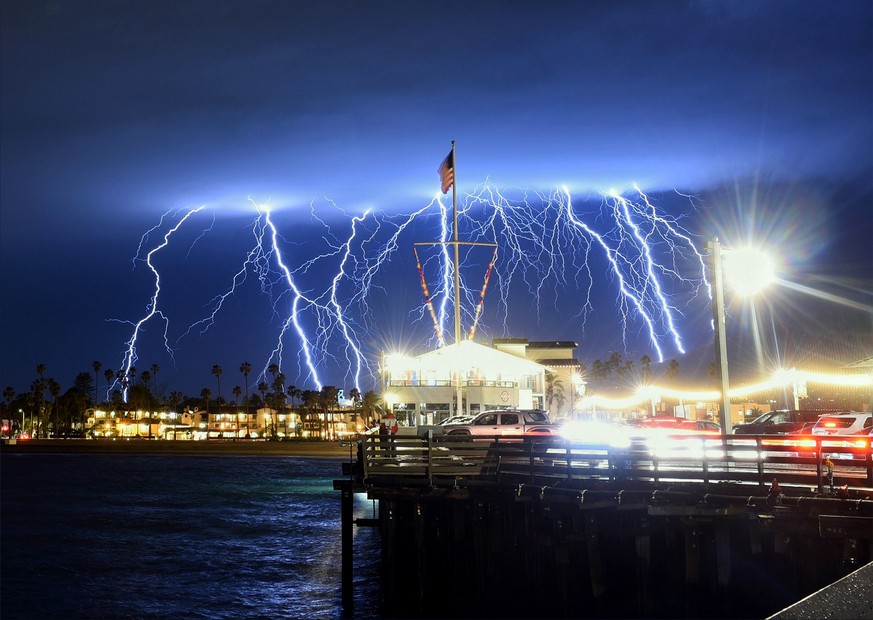 epa07416341 A handout photo made available by the Santa Barbara County Fire Department shows lightning strikes in the skies as a storm approaches Santa Barbara, California, USA, 05 March 2019. The San ...