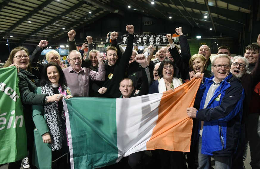 epa08205299 Sinn Fein supporters pictured celebrating after the 08 February general elections, in Dublin, Ireland, 09 February 2020. Exit polls in the Irish general election suggest a three way tie be ...