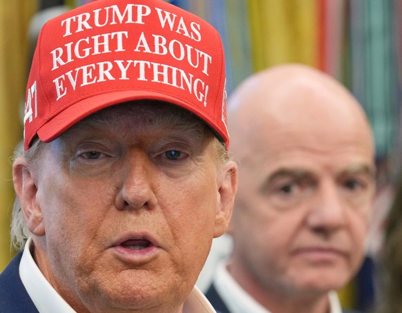 FILE - President Donald Trump speaks as FIFA President Gianni Infantino listens in the Oval Office of the White House, Friday, Aug. 22, 2025, in Washington. (AP Photo/Jacquelyn Martin, File)
Donald Tr ...