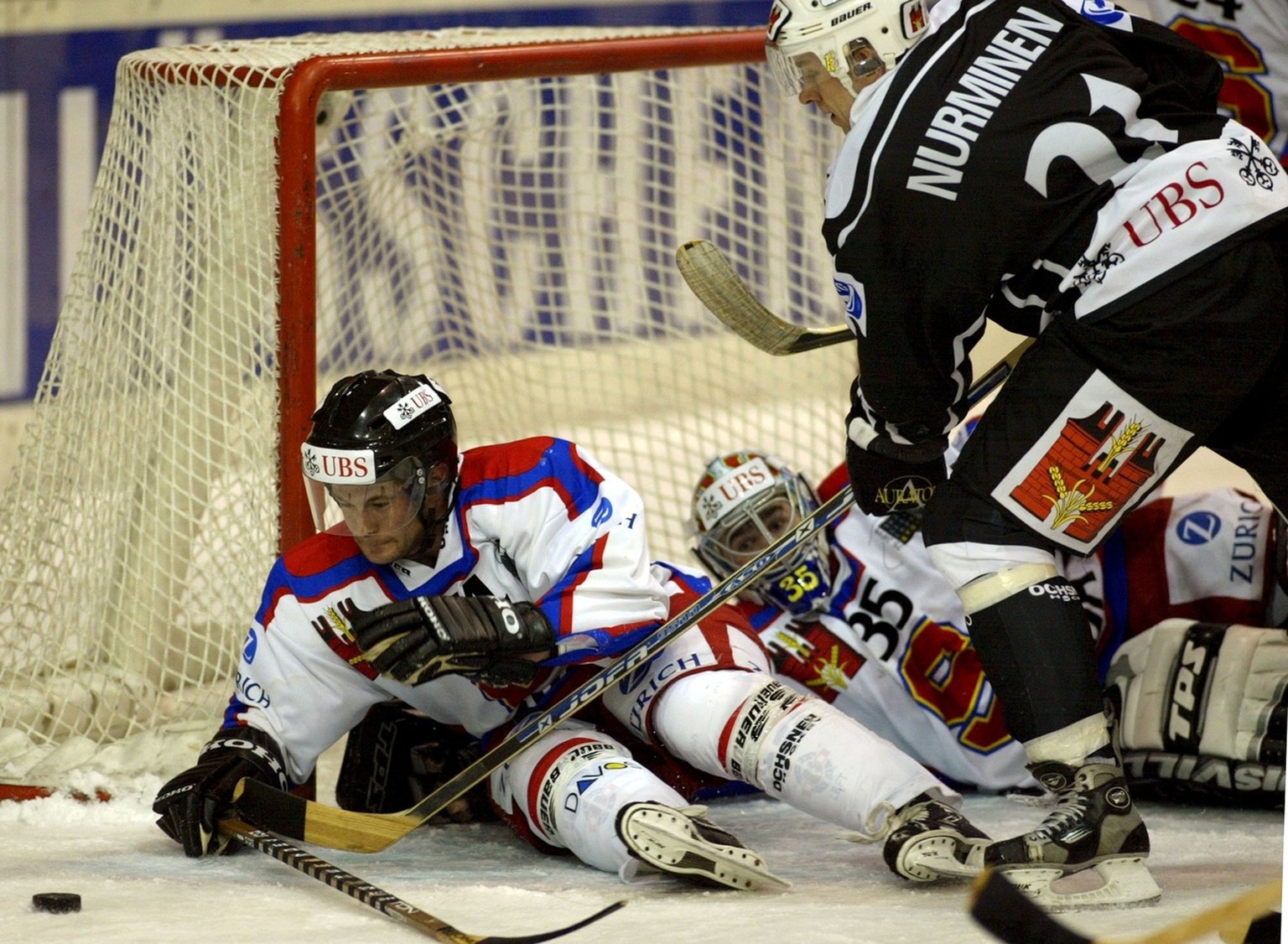 TPS Turku&#039;s Kai Nurminen, right, tries to score against Sparta Prague&#039;s defender Radek Hamr, left, and goalkeeper Petr Prikryl, during the game between TPS Turku vs Sparta Prague, at the Spe ...