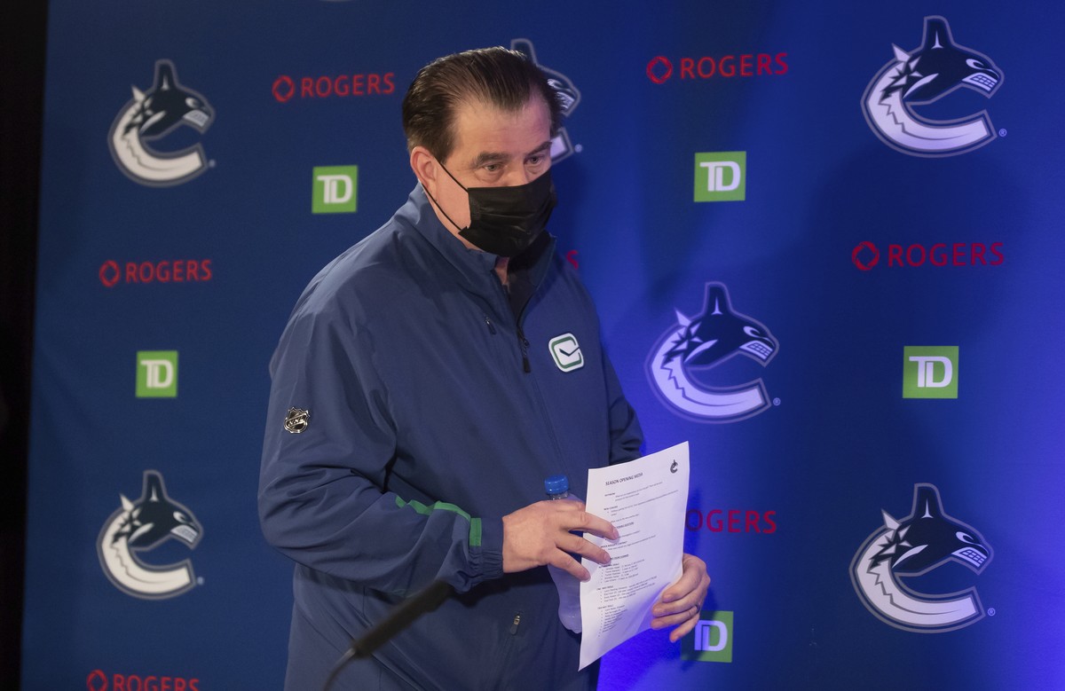 Vancouver Canucks general manager Jim Benning arrives for a news conference ahead of the NHL hockey team's training camp, in Vancouver, British Columbia, Wednesday, Sept. 22, 2021. (Darryl Dyck/T ...