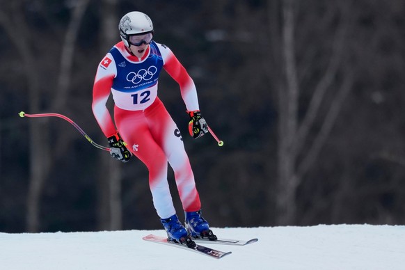 Switzerland's Marco Odermatt speeds down the course during an alpine ski, men's downhill official training, at the 2026 Winter Olympics, in Bormio, Italy, Friday, Feb. 6, 2026. (AP Photo/Jul ...