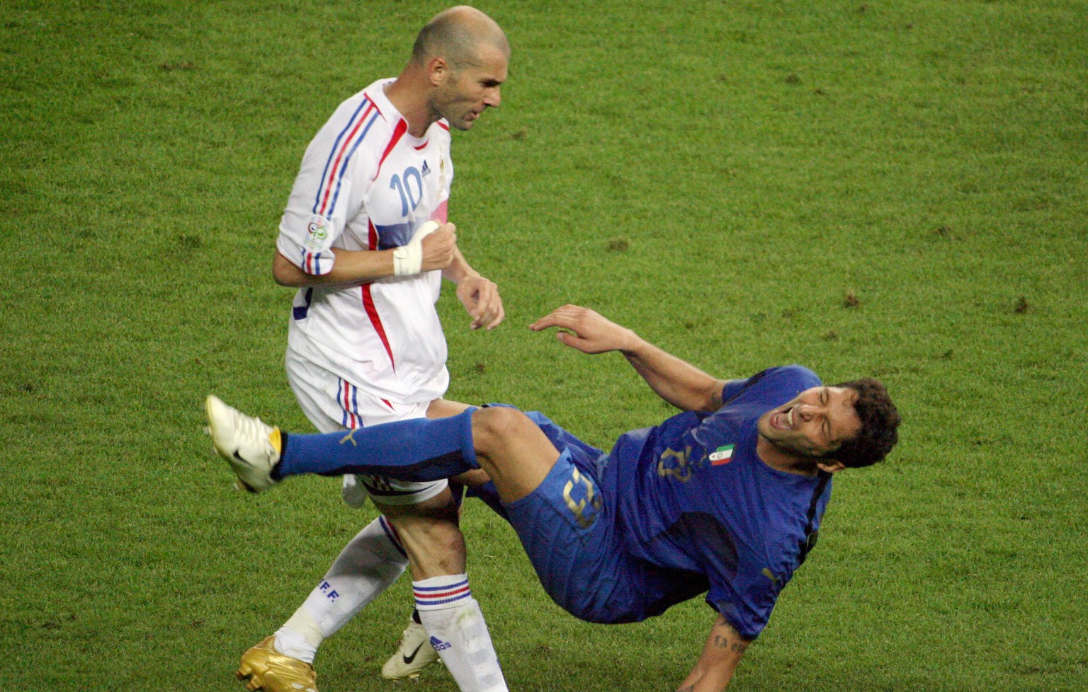 Berlin, GERMANY: A photo taken 09 July 2006 shows French midfielder Zinedine Zidane (L) gesturing after head-butting Italian defender Marco Materazzi during the World Cup 2006 final football match bet ...