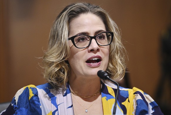 FILE - Sen. Kyrsten Sinema, D-Ariz., speaks during a Senate Finance Committee hearing on Oct. 19, 2021 on Capitol Hill in Washington. Twenty years ago, a Green Party activist running for city council  ...