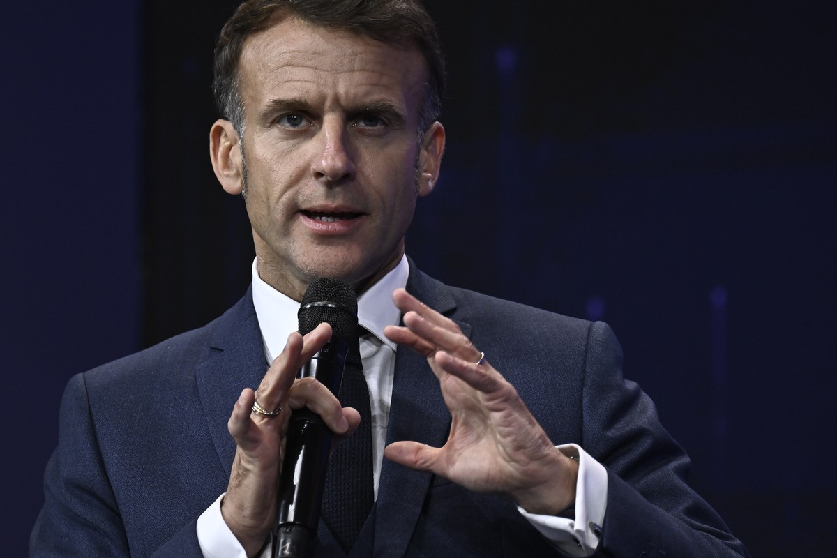 epa12548314 France's President Emmanuel Macron delivers a speech during the opening of the Adopt AI International Summit at the Grand Palais in Paris, France, 25 November 2025. The summit, referr ...