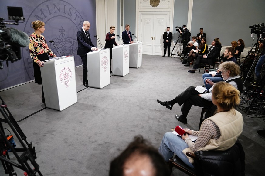 epa09710803 Denmark Prime Minister Mette Frederiksen (C-R), Minister of Health Magnus Heunicke (C-L), director of the Statens Serum Institut Tyra Grove Krause (L), and director of the National Board o ...