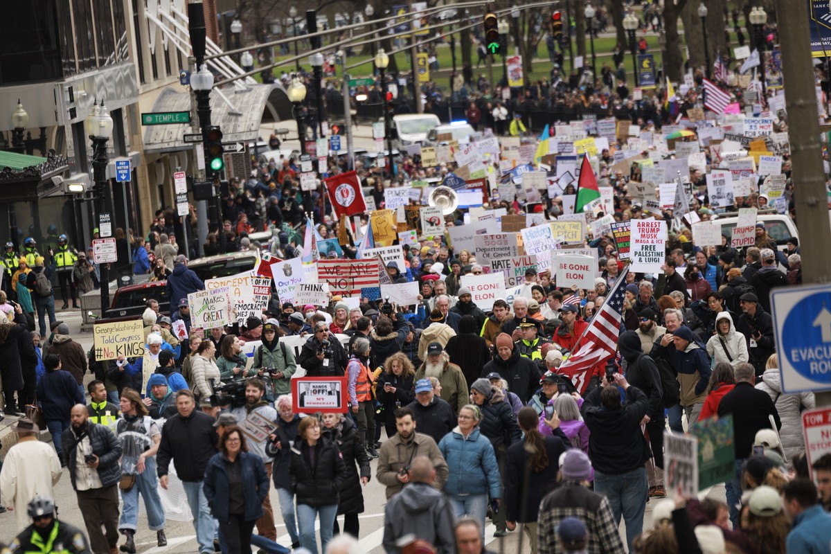 epa12012247 Thousands of people march from Boston Common to Boston City Hall Plaza as part of a nationwide 'Hands Off,' rally aimed at US President Trump and Elon Musk in Boston, Massachuset ...