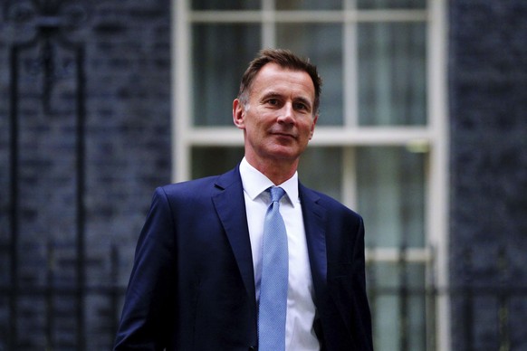 Jeremy Hunt leaves 10 Downing Street in London after he was appointed Chancellor of the Exchequer following the resignation of Kwasi Kwarteng, Friday Oct. 14, 2022. Chancellor of the Exchequer Kwasi K ...